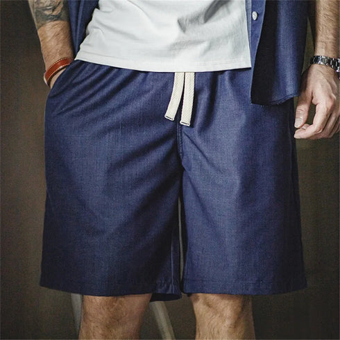 Retro washed denim shorts for men in tencel-blend fabric with elastic waist.